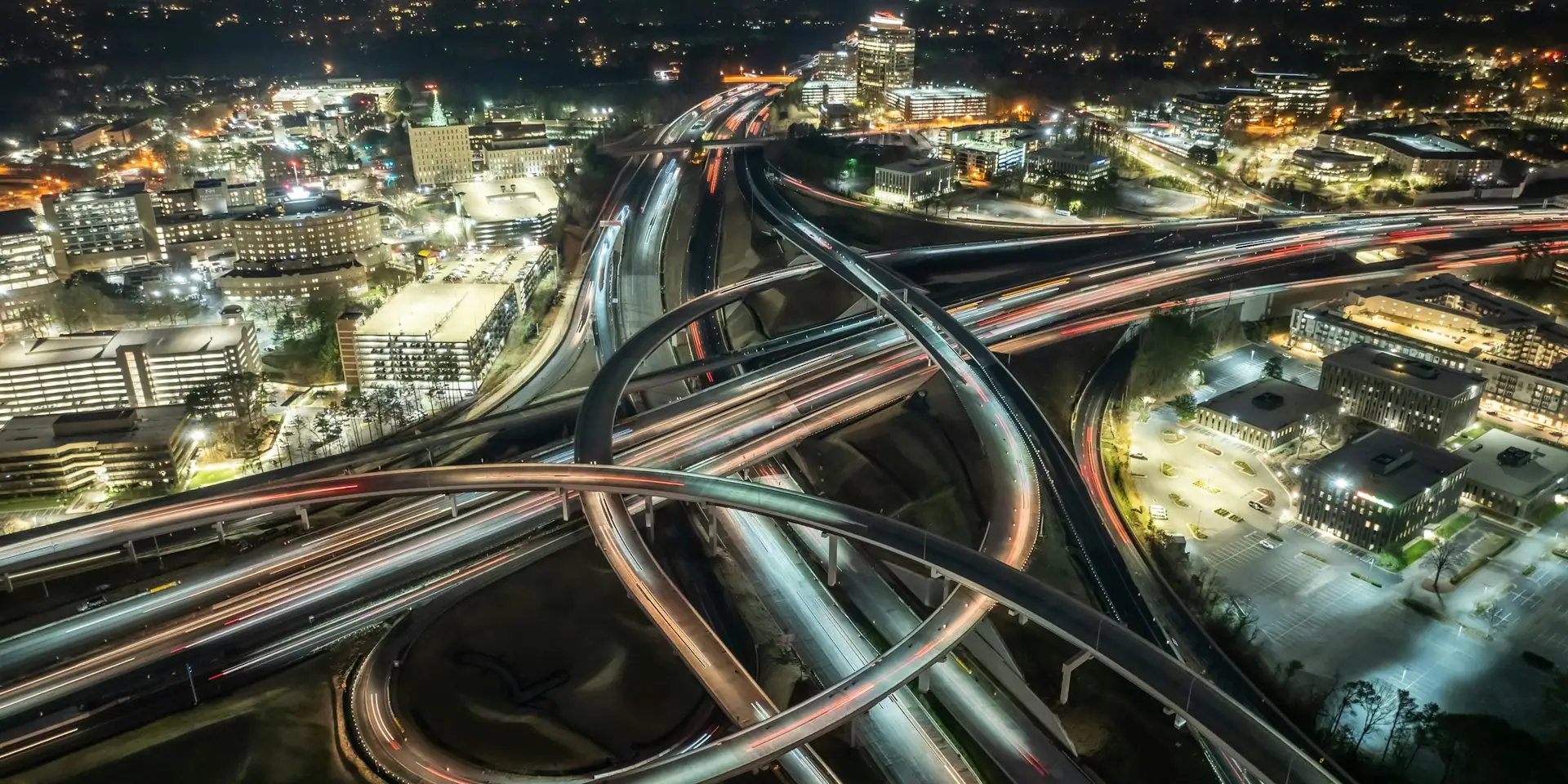 A highway interchange at night, seen from above