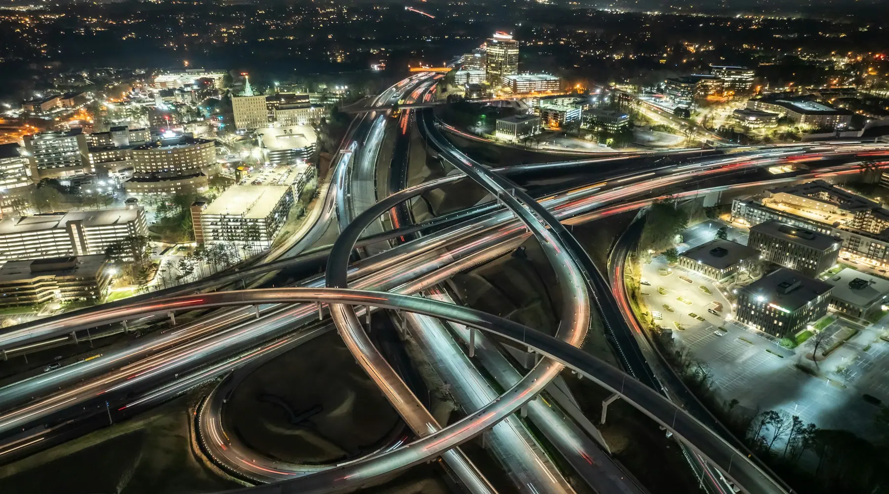 A highway interchange at night, seen from above