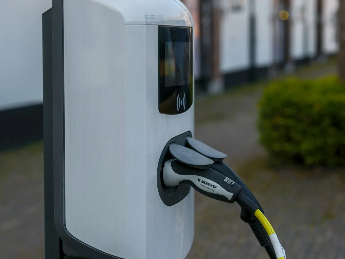 An electric vehicle charger, plugged in